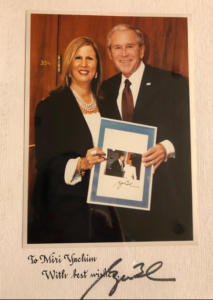 With US President Goerge Bush in the Knesset during his visit to Israel at the 60th state anniversary - holding a picture of them when visiting the Knesset as Governor of Texas